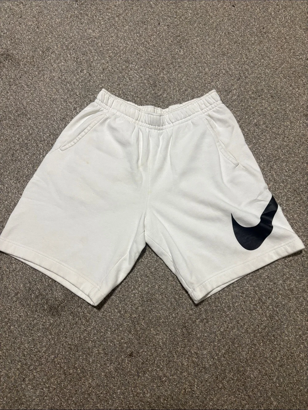 Nike White Athletic Shorts with Black Swoosh